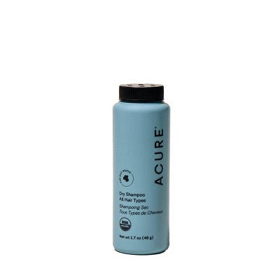 Acure dry shampoo bottle on a white background