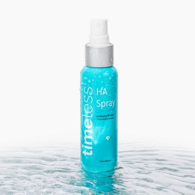 Blue spray bottle labeled 'timeless HA Spray' on a white background