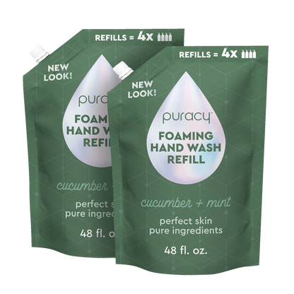 Two green refills of puracy foaming hand wash on a white background