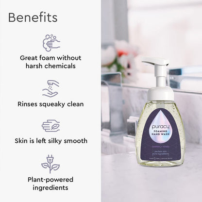Puracy foaming hand wash bottle with benefits listed on a blurred bathroom background
