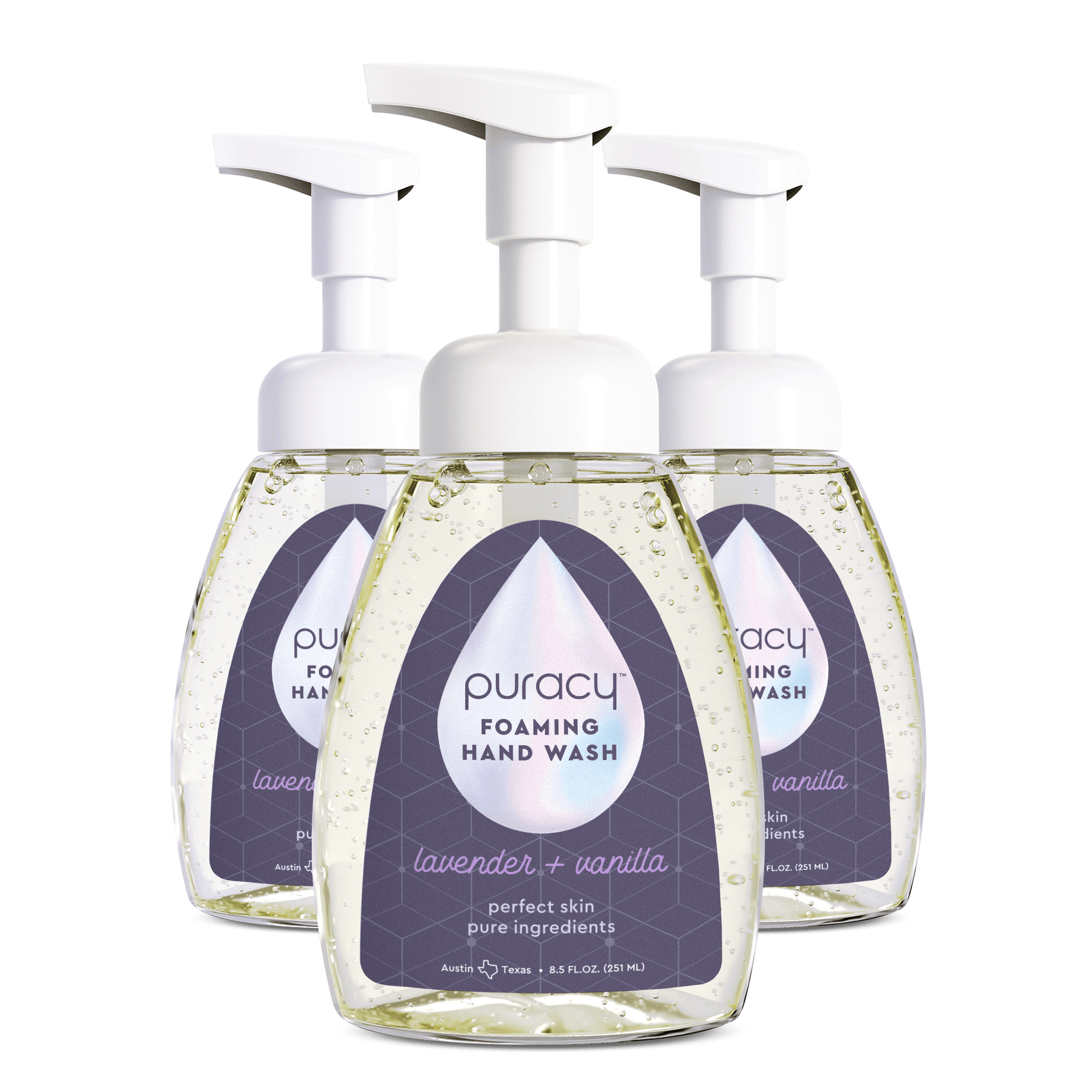 Three bottles of Puracy foaming hand wash on a green background.